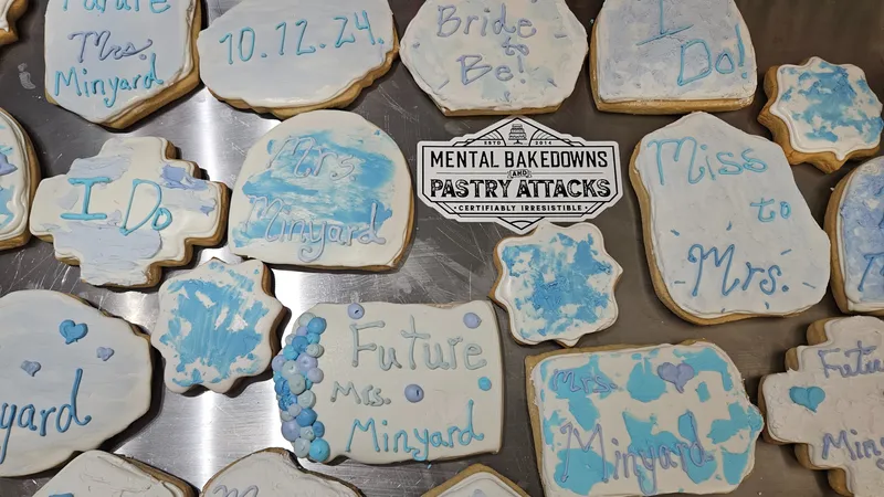Blue and white bridal shower cookies reading I Do, Bride to Be, Miss to Mrs. and Future Mrs., with a Mental Bakedowns & Pastry Attacks plaque