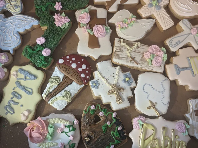 Communion cookies with doves, crosses, roses and a name in script