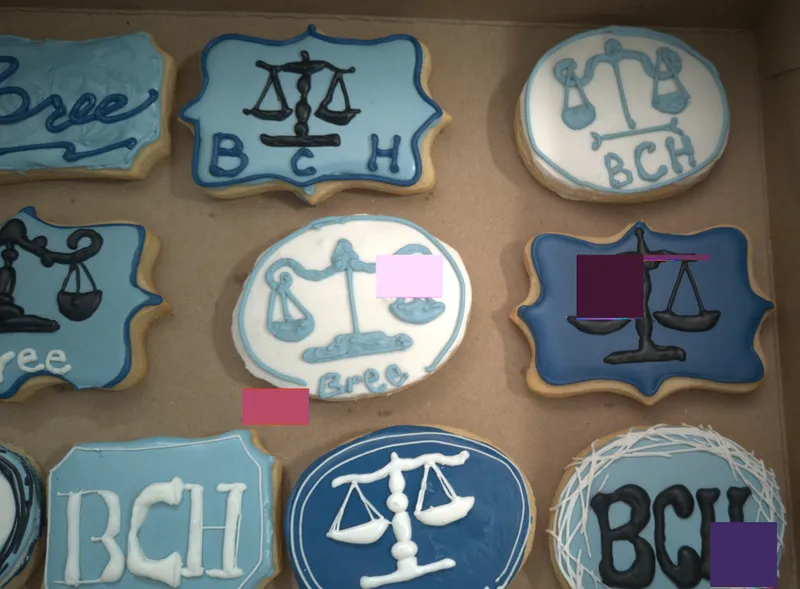 Close view of scales-of-justice cookies in blue and white